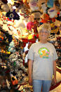 Jackie Miley, 63, is surrounded by teddy bears in this July 21, 2012, photo at Teddy Bear Town in Hill City, S.D. With 7,790 teddy bears in her collection, Miley holds the Guinness World Record for largest teddy bear collection. (AP Photo/Kristi Eaton)