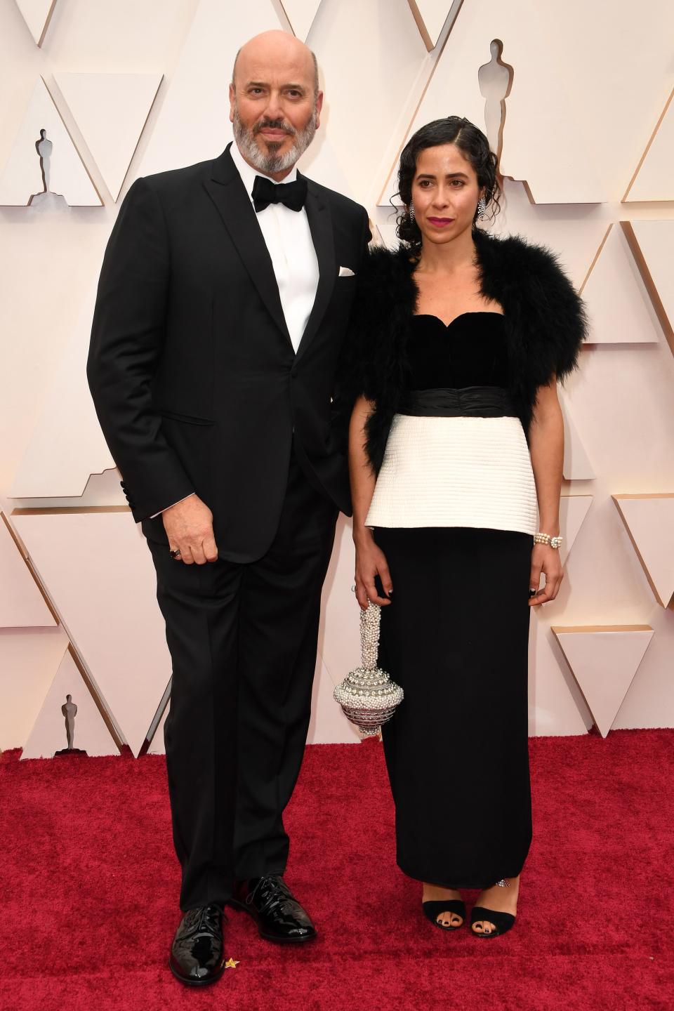 US costume designer for "Joker" Mark Bridges (L) arrives for the 92nd Oscars at the Dolby Theatre in Hollywood, California on February 9, 2020. (Photo by Robyn Beck / AFP) (Photo by ROBYN BECK/AFP via Getty Images)