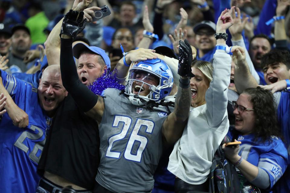 Detroit Lions running back Jahmyr Gibbs celebrates his touchdown with Lions fans against the Las Vegas Raiders during the second half at Ford Field, Monday, Oct. 30, 2023.