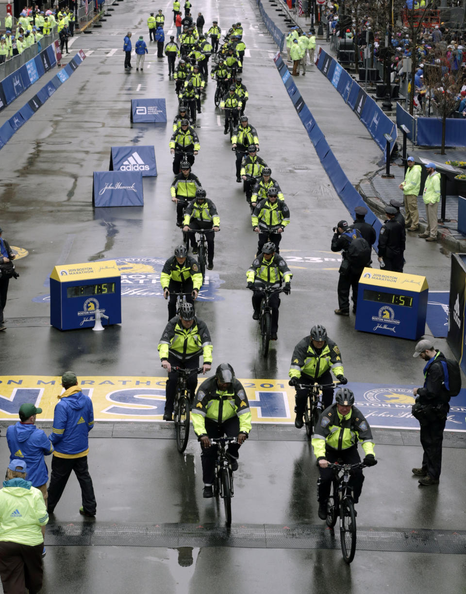 Police officers on bicycles patrol at the finish line before the start of the 123rd Boston Marathon on Monday, April 15, 2019, in Boston. (AP Photo/Charles Krupa)