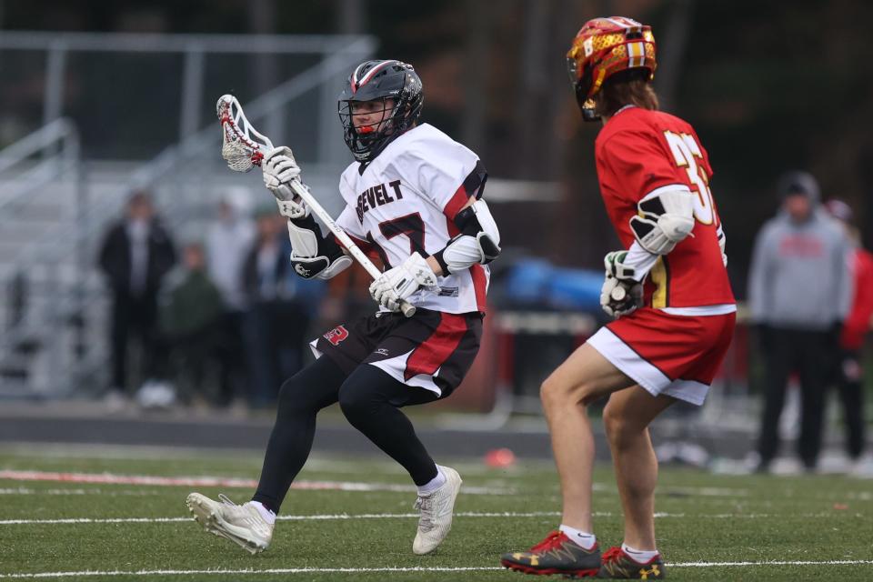 Kent Roosevelt senior Danny Camp cradles the ball downfield during a 2022 game against Brecksville-Broadview Heights at Roosevelt Stadium.