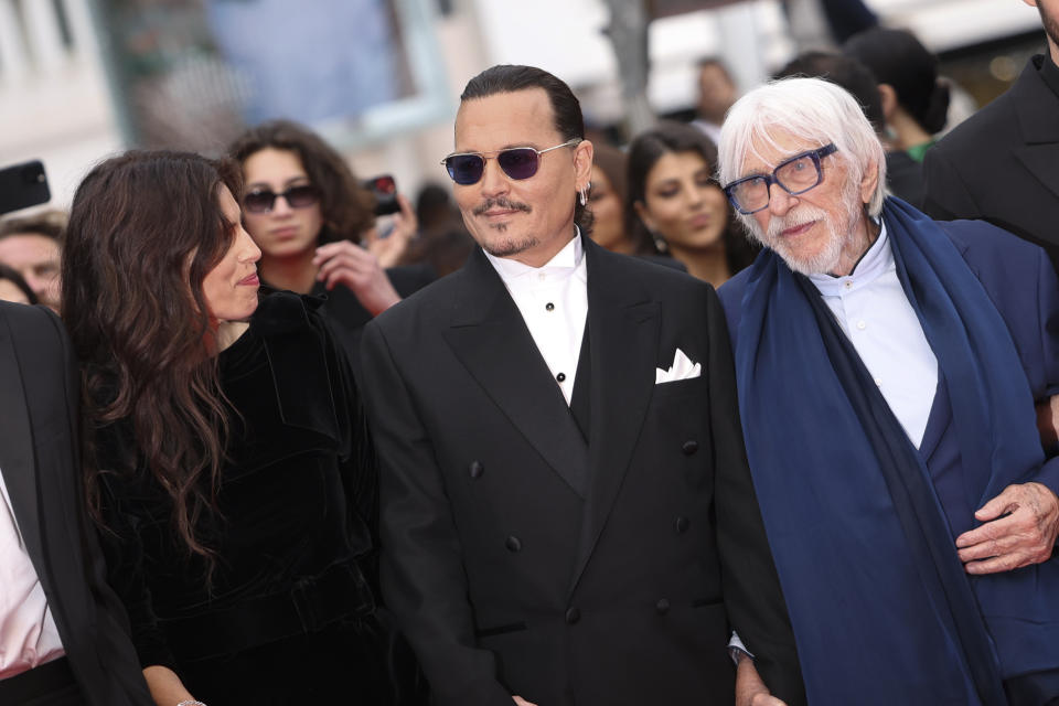Director Maiwenn, from left, Johnny Depp, and Pierre Richard pose for photographers upon arrival at the opening ceremony and the premiere of the film 'Jeanne du Barry' at the 76th international film festival, Cannes, southern France, Tuesday, May 16, 2023. (Photo by Vianney Le Caer/Invision/AP)
