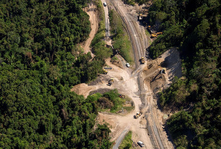 Workmen repair a section of the Goonyella rail system, that services coal mines in the Bowen Bason, after a landslide damaged the tracks as a result of heavy rain associated with Cyclone Debbie, at a section called Black Mountain located near the Queensland town of Mackay in Australia, April 11, 2017. REUTERS/Daryl Wright