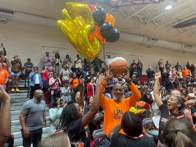 LPA girls basketball coach Wendell Adams (left) after he secured his 500th career victory with a win over Westwood on Jan. 12, 2024.