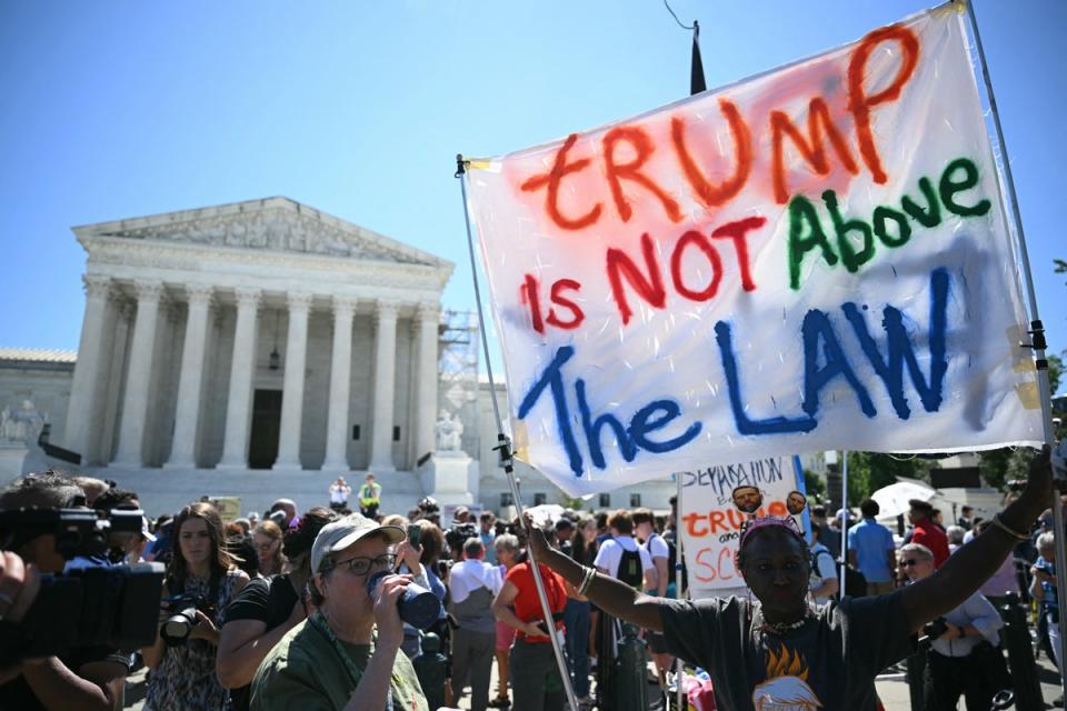 Protesters gather outside the Supreme Court on July 1 as justices grant Donald Trump partial immunity from prosecution in his election interference case (AFP via Getty Images)