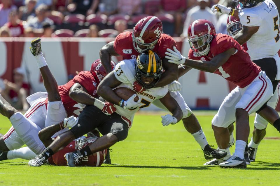 Alabama linebacker Shane Lee stops Southern Mississippi running back Kevin Perkins.