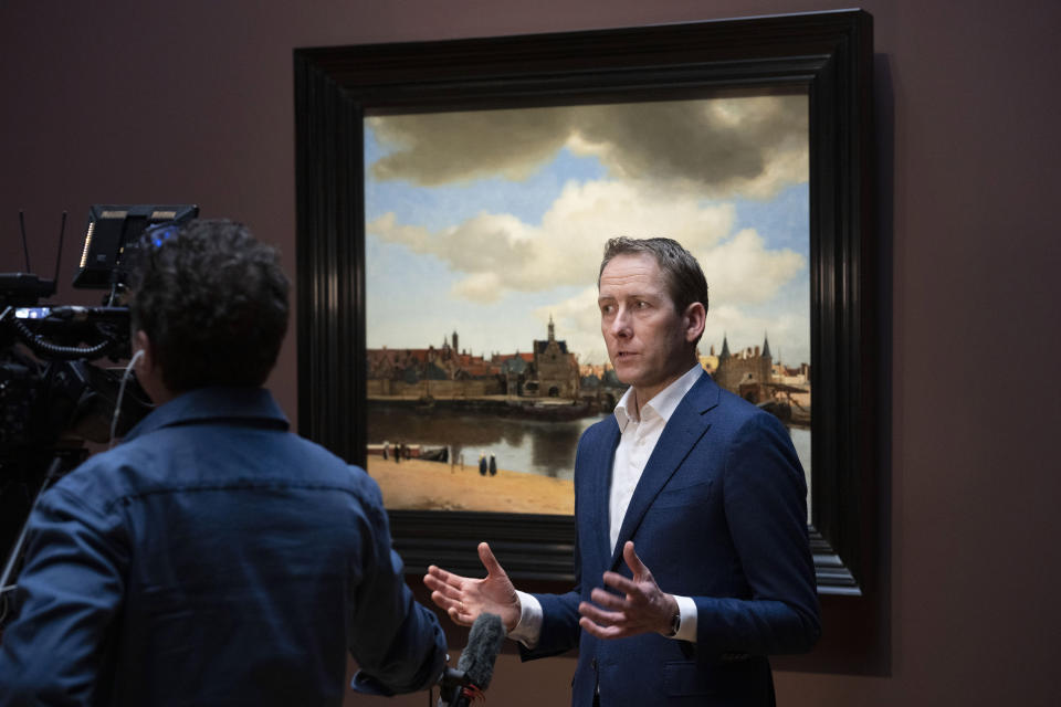 Pieter Roelofs, Head of Paintings and Sculpture, talks in front of View of Delft during a press preview of the Vermeer exhibit at Amsterdam's Rijksmuseum, Monday, Feb. 6, 2023, which unveils its blockbuster exhibition of 28 paintings by 17th-century Dutch master Johannes Vermeer drawn from galleries around the world. (AP Photo/Peter Dejong)