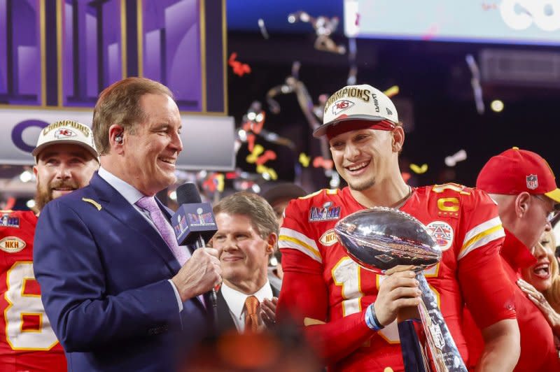 Kansas City Chiefs quarterback Patrick Mahomes holds the Vince Lombardi Trophy after defeating the San Francisco 49ers 25-22 in Super Bowl LVIII on Sunday. Mahomes and his wife Brittany on Thursday visited two girls who were injured in Wednesday's parade shooting, which left one dead and 22 injured. Photo by John Angelillo/UPI