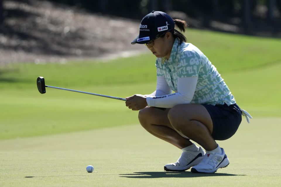 Nasa Hataoka, of Japan, line sup a putt on the third green during the final round of the LPGA CME Group Tour Championship golf tournament, Sunday, Nov. 19, 2023, in Naples, Fla. (AP Photo/Lynne Sladky)