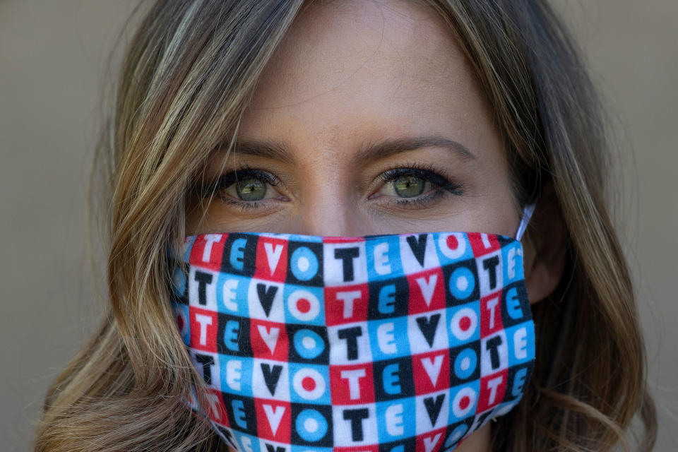 Amber McReynolds wearing a mask that says "vote" on Sept. 29, 2020.<span class="copyright">Rachel Woolf for TIME</span>
