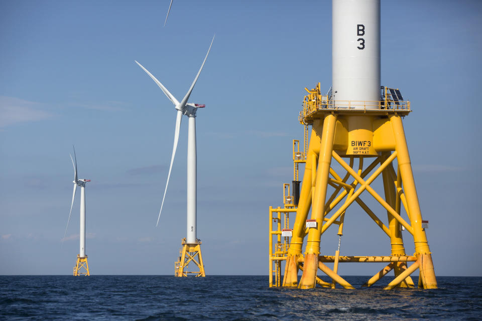 FILE - In this Aug. 15, 2016 file photo, three of Deepwater Wind's five turbines stand in the water off Block Island, R.I, the nation's first offshore wind farm. California and the federal government have agreed to open up areas off the central and northern coasts to massive wind farms. The pact announced Tuesday, May 25, 2021, that would float hundreds of turbines off the coast of Morro Bay and Humboldt Bay was touted as a breakthrough to eventually power 1.6 million homes. (AP Photo/Michael Dwyer, File)