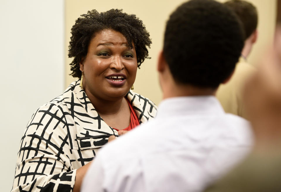 Former gubernatorial candidate Stacey Abrams talks to reporters after campaigning for District 1 Commission candidate Jordan Johnson at the Tabernacle Baptist Church Family Life Center in Augusta, Ga., Friday, Jan. 31, 2019. (Michael Holahan/The Augusta Chronicle via AP)