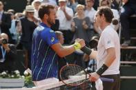 Tennis - French Open - Roland Garros - Mathias Bourgue of France v Andy Murray of Britain - Paris, France - 25/05/16. Murray shakes hands with Bourgue at the end of the match. REUTERS/Gonzalo Fuentes