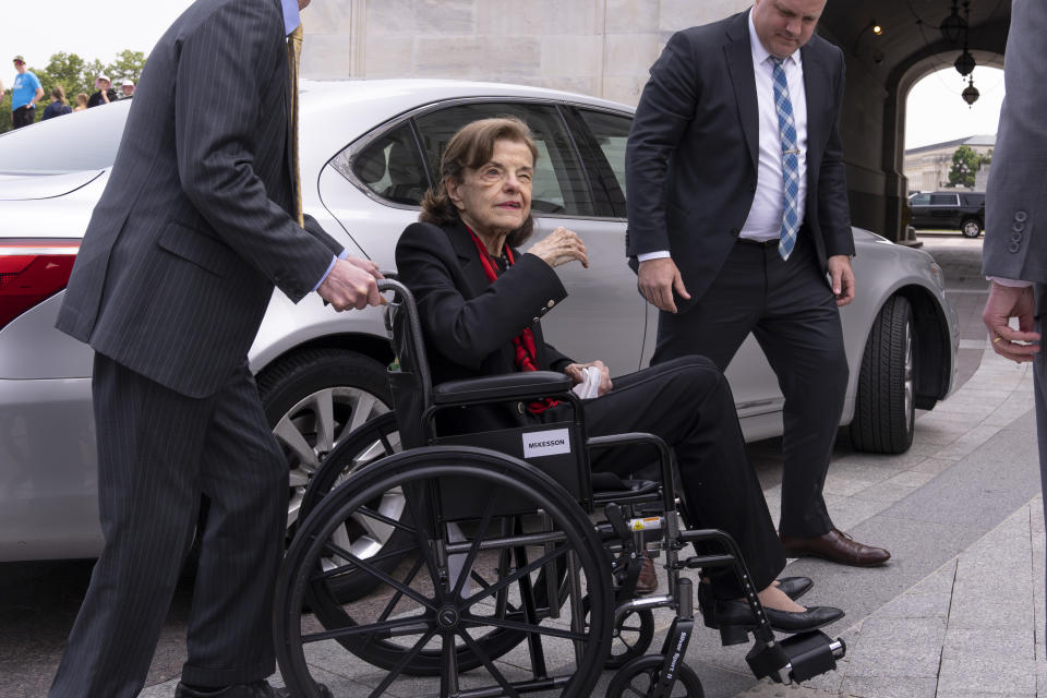 FILE - Sen. Dianne Feinstein, D-Calif., is assisted to a wheelchair by staff as she returns to the Senate after a more than two-month absence, at the Capitol in Washington, Wednesday, May 10, 2023. Feinstein’s office said Thursday, May 18, that she is suffering from Ramsay Hunt syndrome, a complication from the shingles virus that can paralyze part of the face, and that she contracted encephalitis while recovering from the virus earlier this year. (AP Photo/J. Scott Applewhite, File)