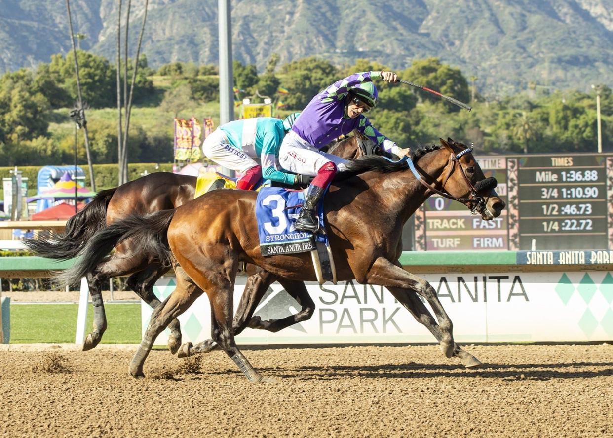 Stronghold and jockey Antonio Fresu win the Santa Anita Derby on April 6 at Santa Anita Park in Arcadia, California.