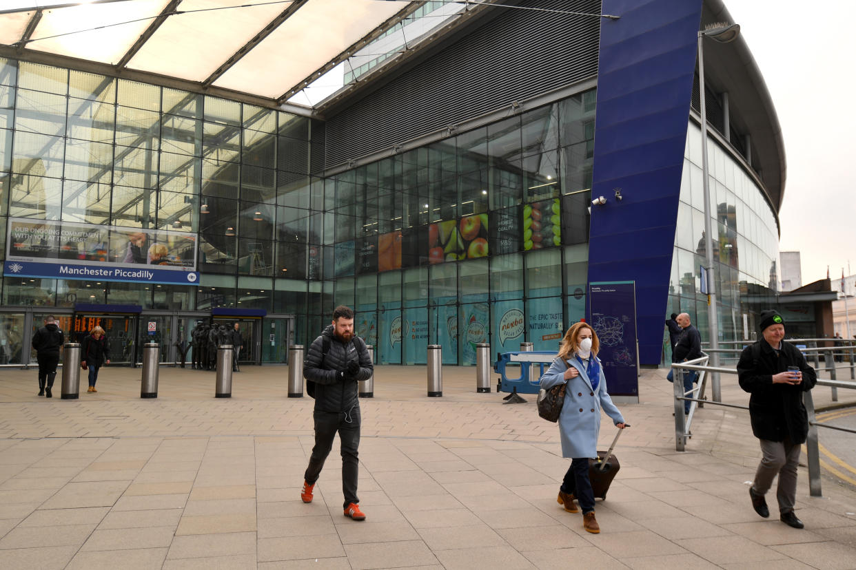 MANCHESTER, ENGLAND - MARCH 19: A woman wears a face mask as she leaves Piccadilly train station on March 19, 2020 in Manchester, United Kingdom. People have been encouraged to work from home and socially distance themselves due to the coronavirus (COVID-19) pandemic. (Photo by Anthony Devlin/Getty Images)