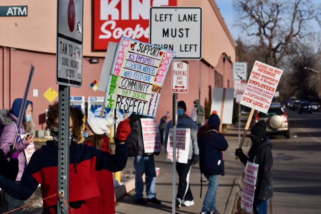 Workers and community members form a picket line outside a Denver King Soopers, after United Food and Commercial Workers Local 7 began a strike over stalled labor negotiations on Jan. 12, 2021
