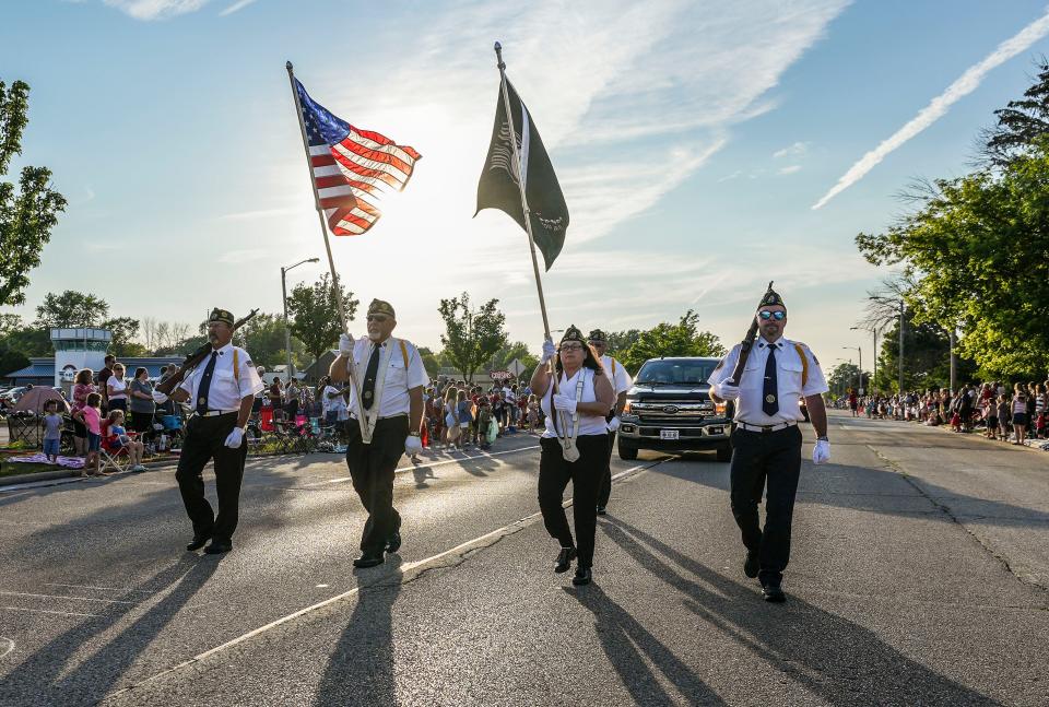 Members of American Legion Post 382 of Menomonee Falls march down Appleton Avenue during the annual Independence Day parade on Sunday, July 3, 2022.