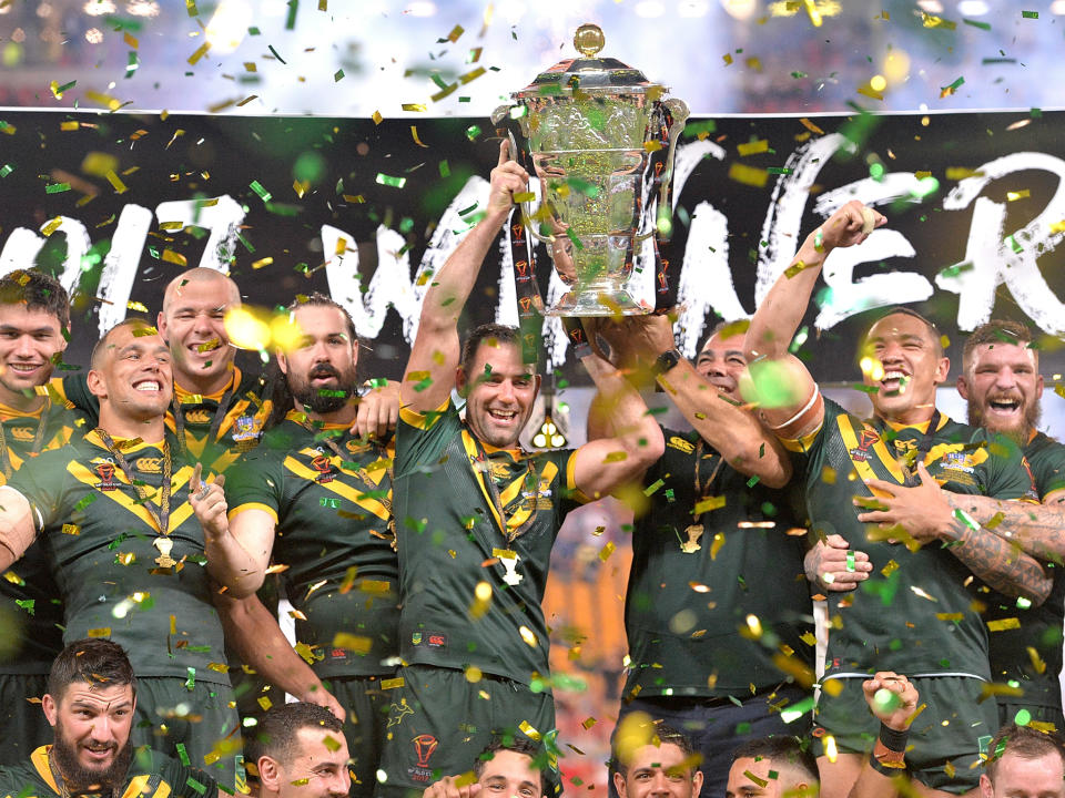 Cameron Smith and coach Mal Malinga lift the Rugby League World Cup: Getty