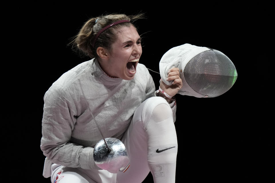 Sofia Pozdniakova celebrates after the gold at the women's individual Sabre final competition at the 2020 Summer Olympics, Monday, July 26, 2021, in Chiba, Japan. (AP Photo/Andrew Medichini)