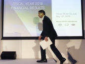 Nissan Motor Co. Chief Executive Hiroto Saikawa arrives for a press conference at its Global Headquarters in Yokohama, near Tokyo Tuesday, May 14, 2019. Japanese automaker Nissan, reeling from the arrest of its former Chairman Carlos Ghosn, reported Tuesday that annual profit nose-dived to less than half of what it earned the previous year, and forecast even dimmer results going forward.(AP Photo/Koji Sasahara)