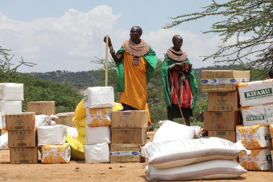 Women from the Samburu tribe wait for a food donation given due to an ongoing drought, in the town of Oldonyiro, Isiolo county, Kenya, October 8, 2021. Picture taken October 8, 2021. REUTERS/Baz Ratner REFILE - CORRECTING INFORMATION