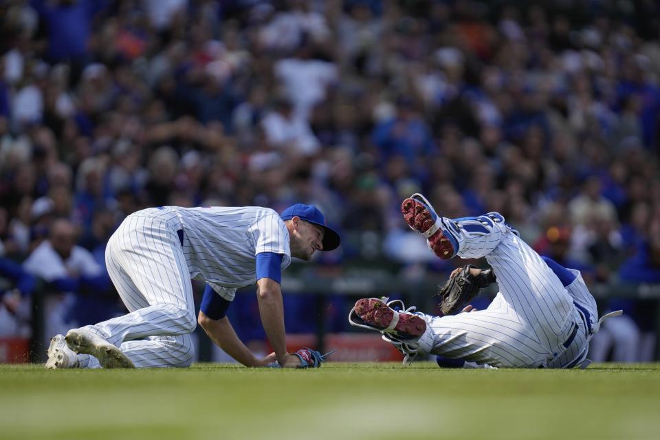 Chicago Cubs catcher Yan Gomes collides with Chicago Cubs starting pitcher Drew Smyly, preventing the throw to first base and ending his chance at a perfect game during the eighth inning of a baseball game against the Los Angeles Dodgers Friday, April 21, 2023, in Chicago. (AP Photo/Erin Hooley)