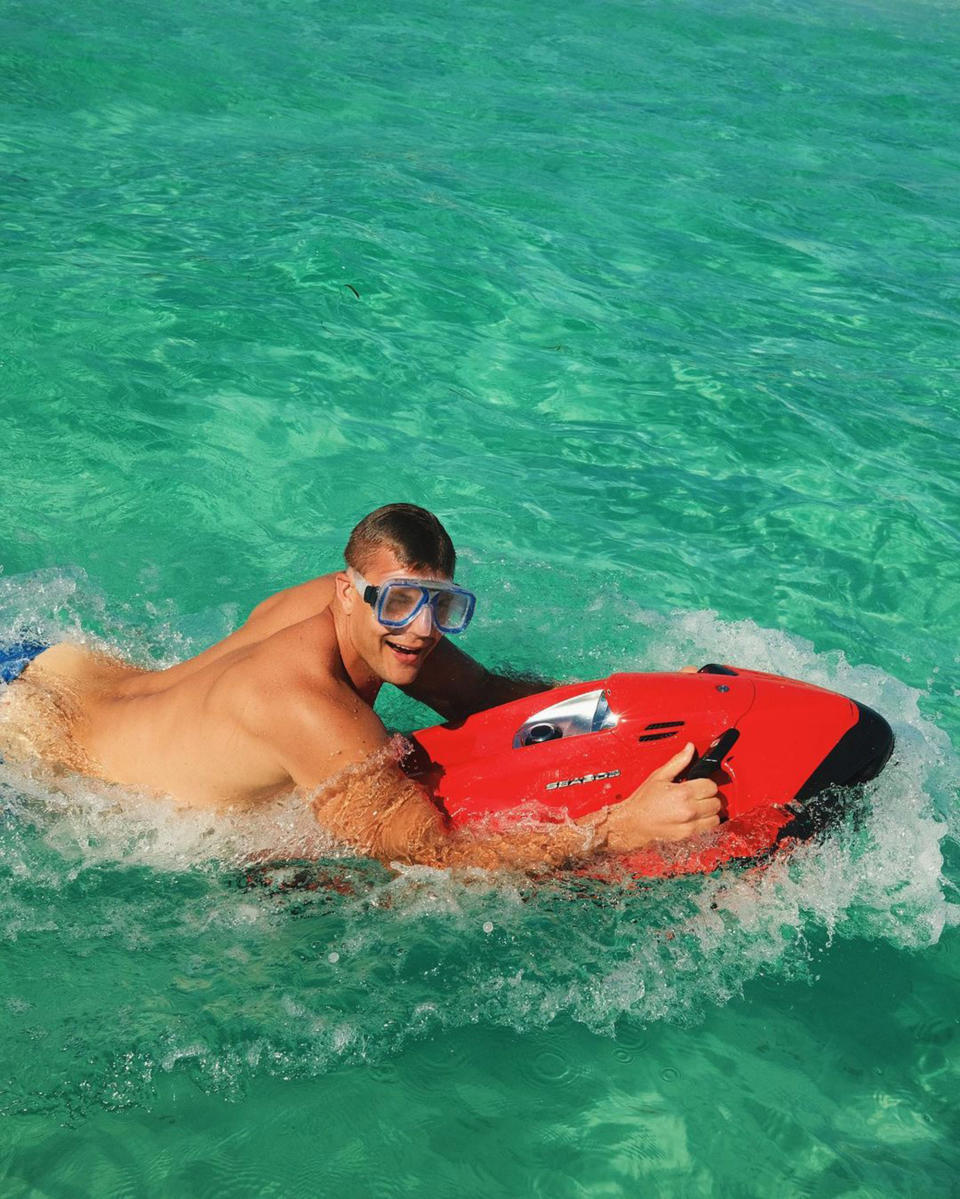 Rob Gronkowski swims in the ocean on vacation. (@tombrady via Instagram)