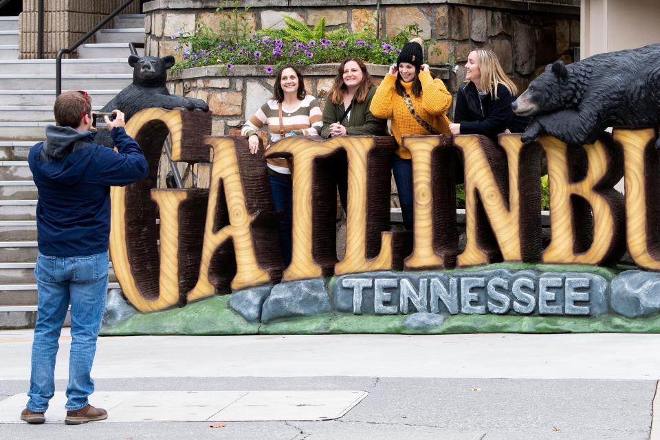 Tourists take advantage of a good photo outside the Gatlinburg Convention Center.