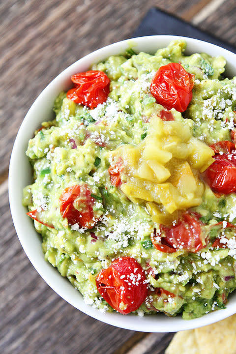 <strong>Get the <a href="http://www.twopeasandtheirpod.com/green-chile-and-roasted-tomato-guacamole/" target="_blank">Green Chile and Roasted Tomato Guacamole recipe</a> from Two Peas and their Pod</strong>