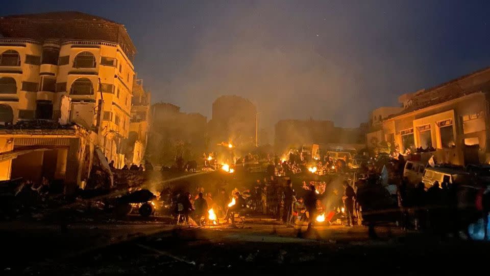 A photo taken by Abdallah Dalee in the early hours of February 29 shows a crowd of people waiting by firelight for the aid trucks to cross into northern Gaza. - Courtesy Abdallah Dalee