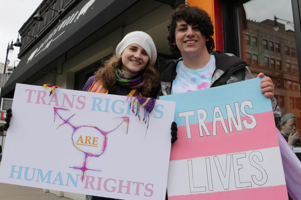 Students hold up signs at transgender rights protest in Chicago, 2017 (AFP via Getty Images)