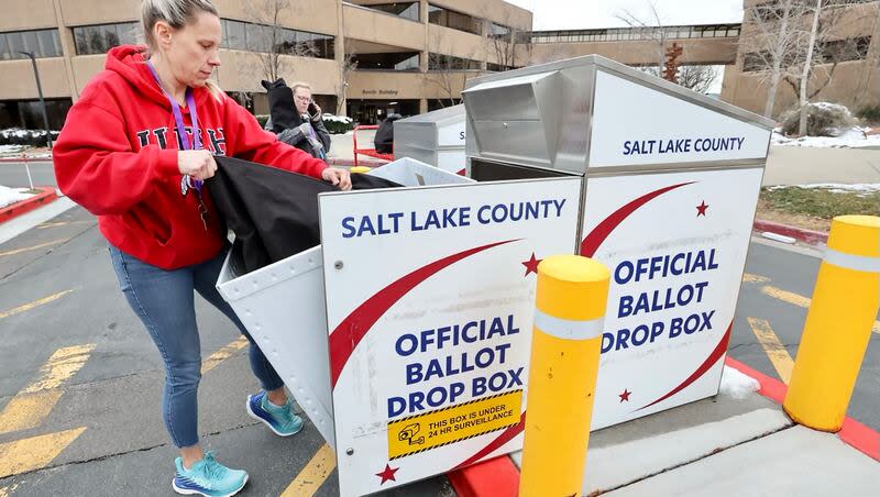Election coordinator Holly Birich collects ballots from the drop box located at the Salt Lake County Government Center in Salt Lake City on Tuesday morning, March 5, 2024.