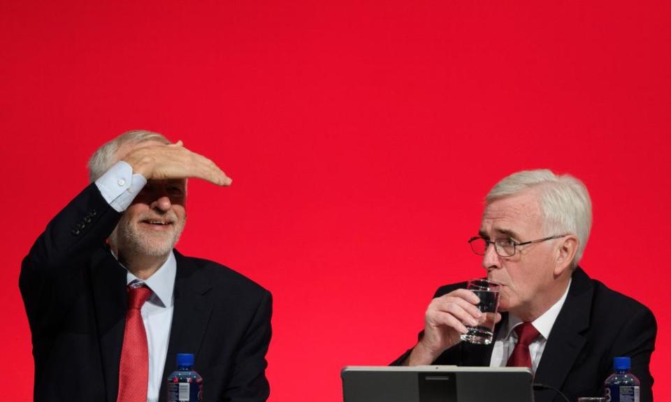 Labour party leader Jeremy Corbyn, with the shadow chancellor, John McDonnell, looks out at the delegates in the Exhibition Centre in Liverpool.