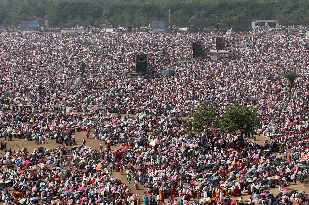 People attend an award function during a hot day on the outskirts of Mumbai on 16 April (REUTERS)