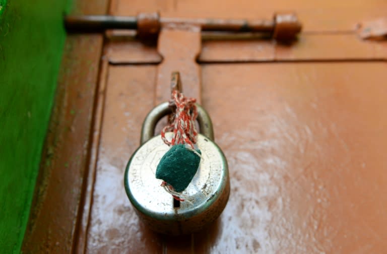 An amulet hangs from a padlock at the house of the eight-year-old girl, who was raped and murdered, at Rasana village in Kathua district of Jammu