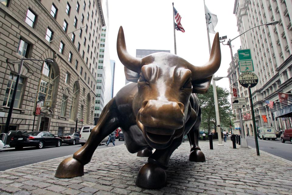 This Wednesday, Oct. 18, 2006 file photo shows the charging bull in lower Manhattan in New York. Police have arrested a 33-year-old woman accused of dumping blue paint over the iconic "Charging Bull" statue on Wall Street. Police say Courtney Fallon was arrested Friday, Sept. 15, 2017 on charges of making graffiti and criminal mischief. (AP Photo/Mary Altaffer, File) ORG XMIT: NY123