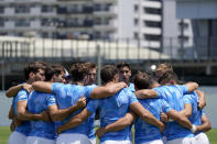 Members of Argentina's men's rugby sevens team huddle on the field during a practice at the Tokyo 2020 Olympics, in Tokyo, Friday, July 23, 2021. (AP Photo/David Goldman)