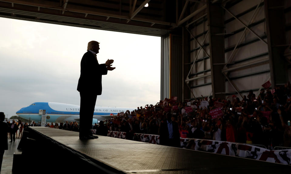 Trump applauds his crowd as he holds a "Make America Great Again" rally at Orlando Melbourne International Airport in Melbourne, Florida, on Feb. 18, 2017.