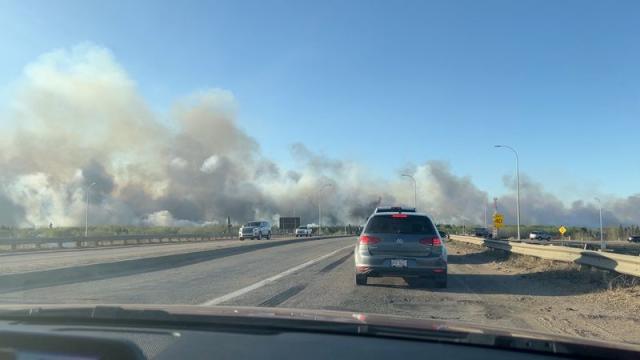 Smoke rises from a wildfire in Strathcona County, Alberta