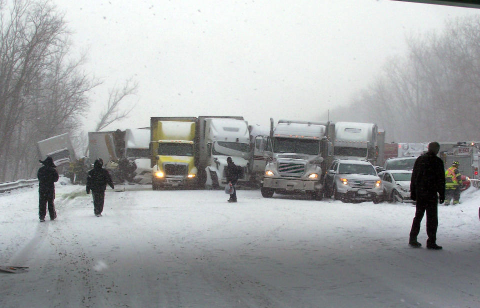 This photo provided by the Indiana State Police onThursday, Jan 23, 2014, shows the scene multi-vehicle crash involving several trucks and cars in Porter, Ind. One person was killed in the accident where several tractor-trailers jackknifed and collided. Several passenger cars also were involved. Interstate 94 is closed at State Highway 49 eastbound. (AP Photo/Indiana State Police)