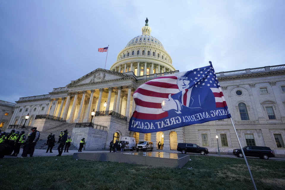 Trump supporters left a flag outside the Capitol, Wednesday evening, Jan. 6, 2021, in Washington. As Congress prepares to affirm President-elect Joe Biden's victory, thousands of people have gathered to show their support for President Donald Trump and his claims of election fraud. (AP Photo/Manuel Balce Ceneta)