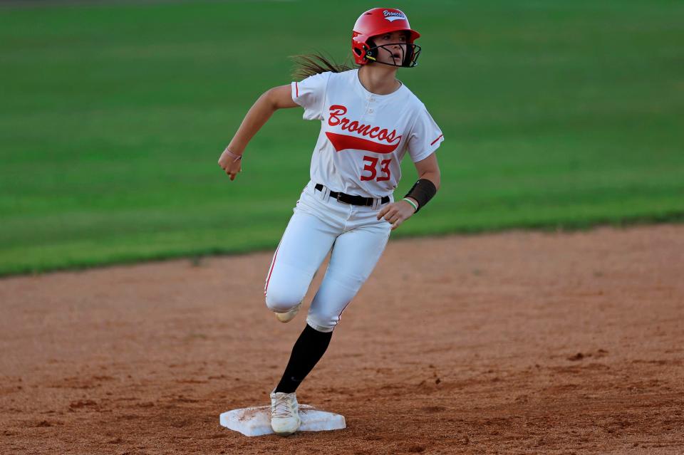 Middleburg's Kaelyn Hagan (33) rounds second base after hitting a home run on April 23 against Baker County.