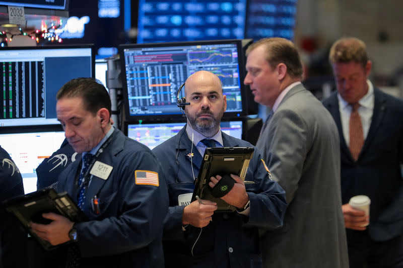 Traders work on the floor of the New York Stock Exchange (NYSE) in New York, U.S., December 11, 2018. REUTERS/Brendan McDermid