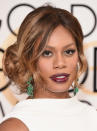 <p>Laverne Cox’s ombre caramel waves frame her face and coil into a bouquet on the right side of her head. The style channels classic, feminine old Hollywood. <i>(Photo: Getty Images)</i></p>