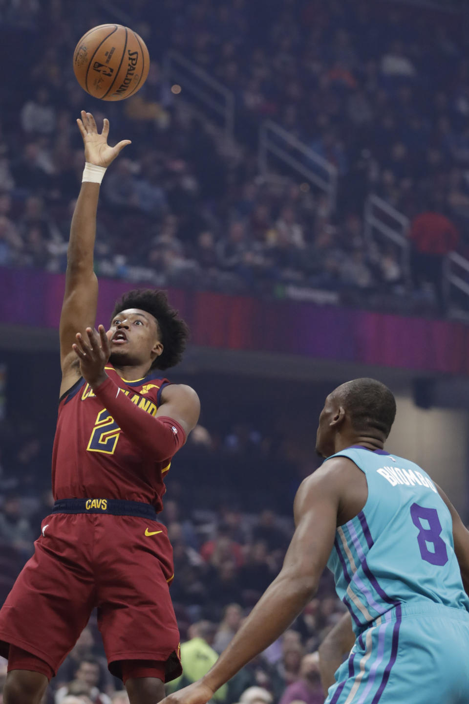 Cleveland Cavaliers' Collin Sexton (2) shoots against Charlotte Hornets' Bismack Biyombo (8) in the first half of an NBA basketball game, Thursday, Jan. 2, 2020, in Cleveland. (AP Photo/Tony Dejak)