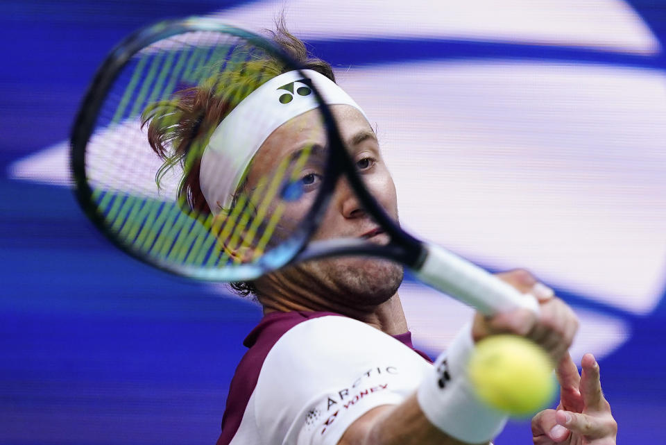 Casper Ruud, of Norway, returns a shot to Karen Khachanov, of Russia, during the semifinals of the U.S. Open tennis championships, Friday, Sept. 9, 2022, in New York. (AP Photo/Matt Rourke)