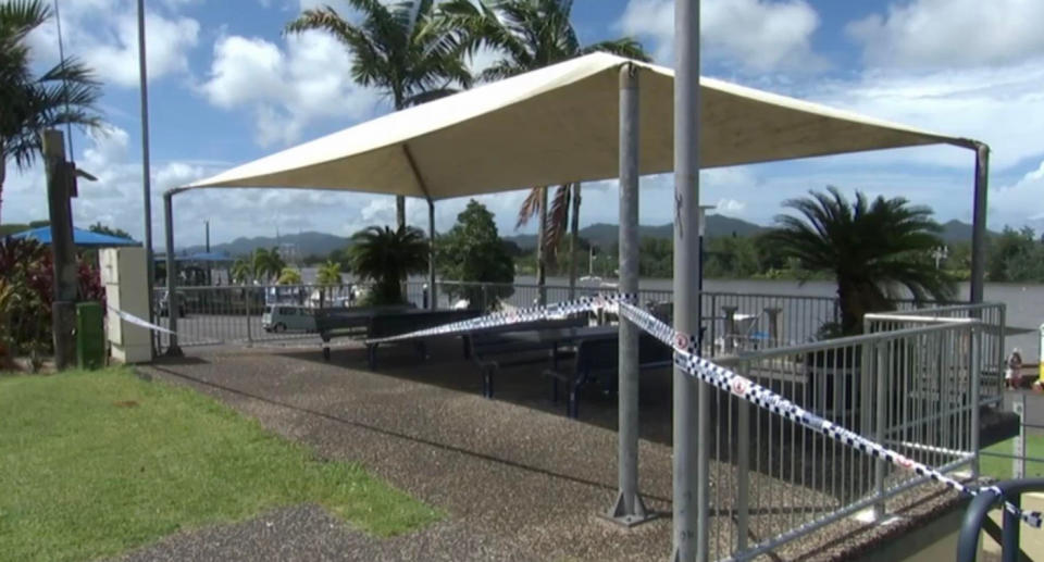 Police tape surrounds benches at the Innisfail park. 