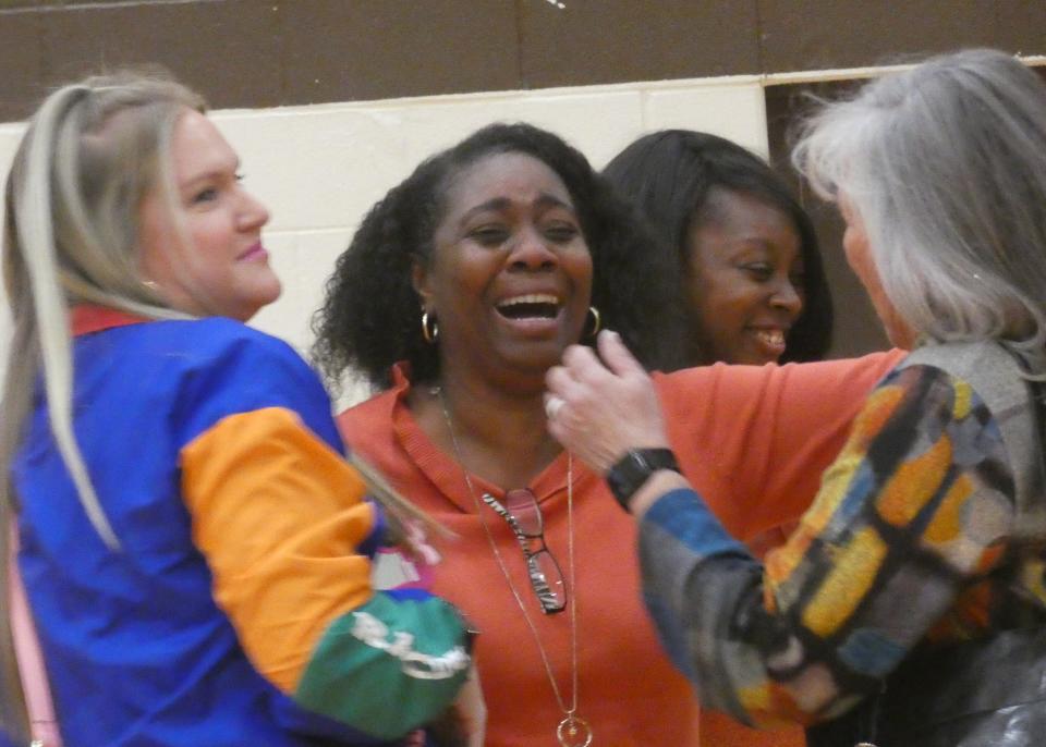 Heath volleyball coach Shela Croom greets former coaches and players before the match against Licking Heights on Tuesday, Oct. 4, 2022. Croom, who is retiring after 28 seasons, was "overwhelmed" by the surprise pre-game ceremony.