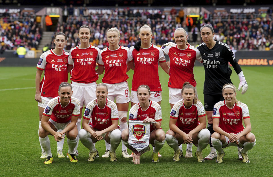 Arsenal players line up ahead of the FA Women's Continental Tyres League Cup Final at Molineux Stadium, Wolverhampton, England, Sunday March 31, 2024. (David Davies/PA via AP)